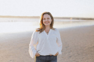 blonde woman white shirt beach political strategist